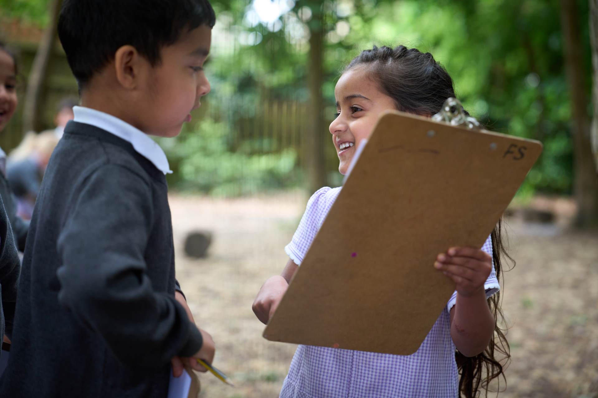 children with clipboard